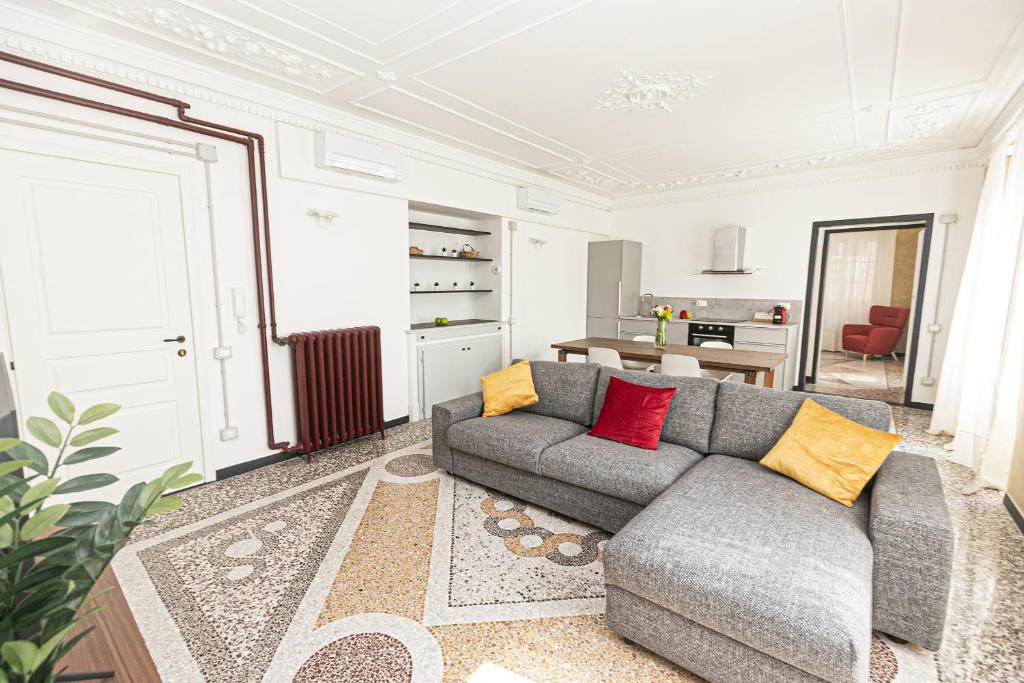 a living room with a couch and a table at iFlat Historical Luxury Apartment San Luca 11 A in Genova