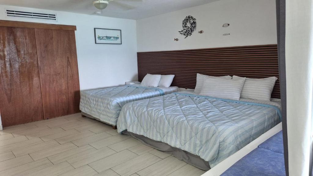 Postel nebo postele na pokoji v ubytování Puerto Vallarta Condo Frente al mar