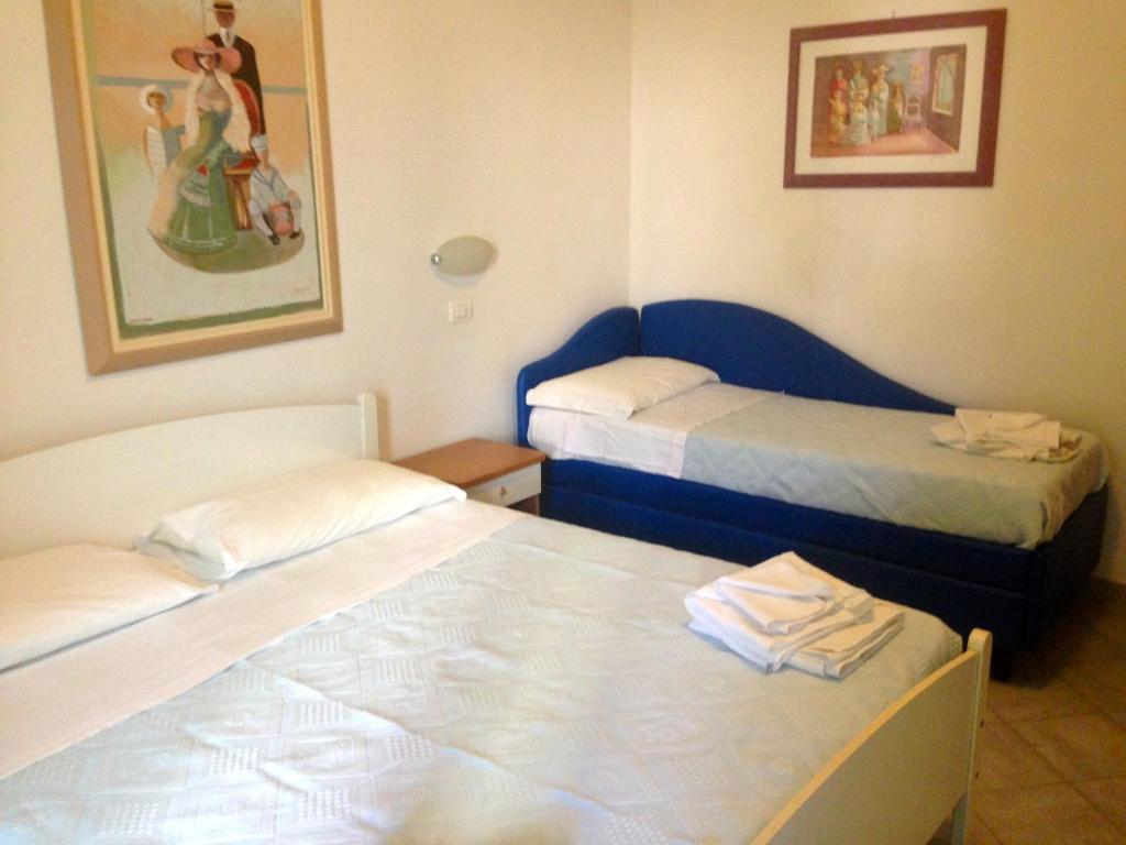 Postel nebo postele na pokoji v ubytování Hotel Jole