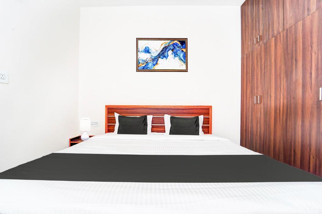 Postel nebo postele na pokoji v ubytování Super Hotel O Aarapalayam