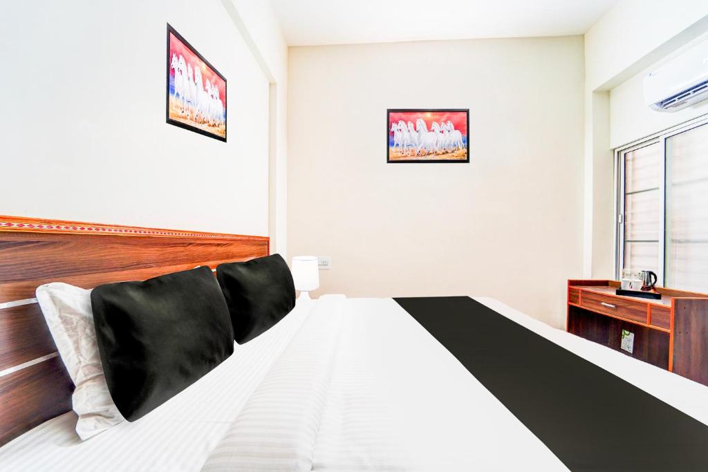 Postel nebo postele na pokoji v ubytování Super Hotel O Aarapalayam