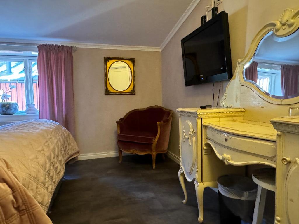 Postel nebo postele na pokoji v ubytování Hotell Vaxblekaregården