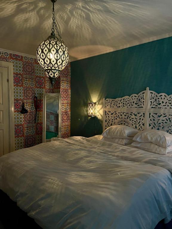 Postel nebo postele na pokoji v ubytování Hotell Vaxblekaregården