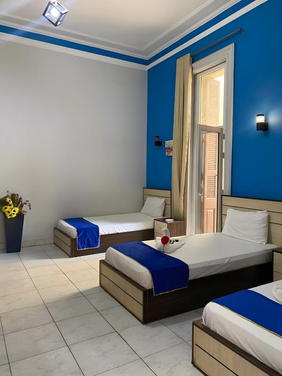Postel nebo postele na pokoji v ubytování Hostgram Hotel in cairo