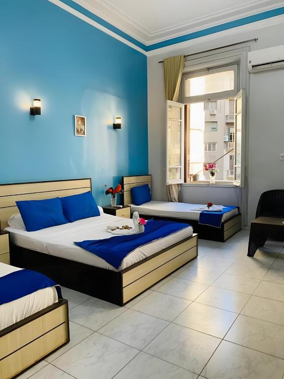 Postel nebo postele na pokoji v ubytování Hostgram Hotel in cairo