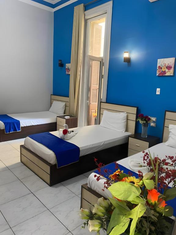 Postel nebo postele na pokoji v ubytování Hostgram Hotel in cairo