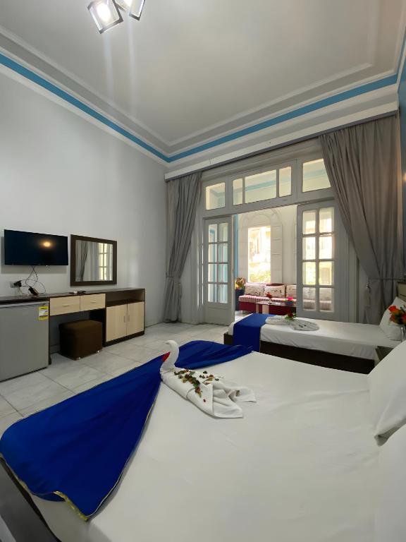 Postel nebo postele na pokoji v ubytování Hostgram Hotel in cairo