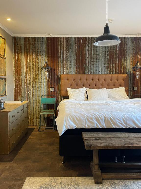 Postel nebo postele na pokoji v ubytování Hotell Vaxblekaregården