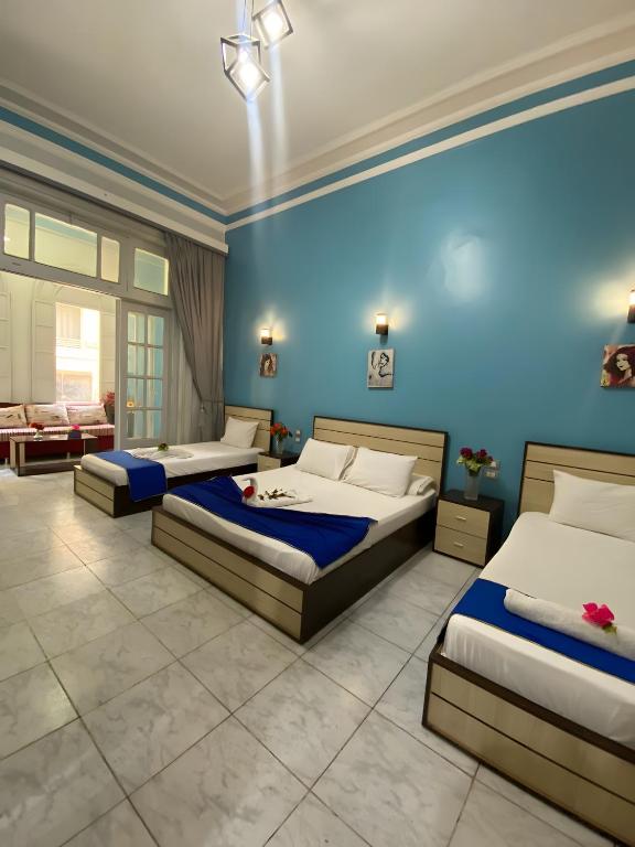 Postel nebo postele na pokoji v ubytování Hostgram Hotel in cairo