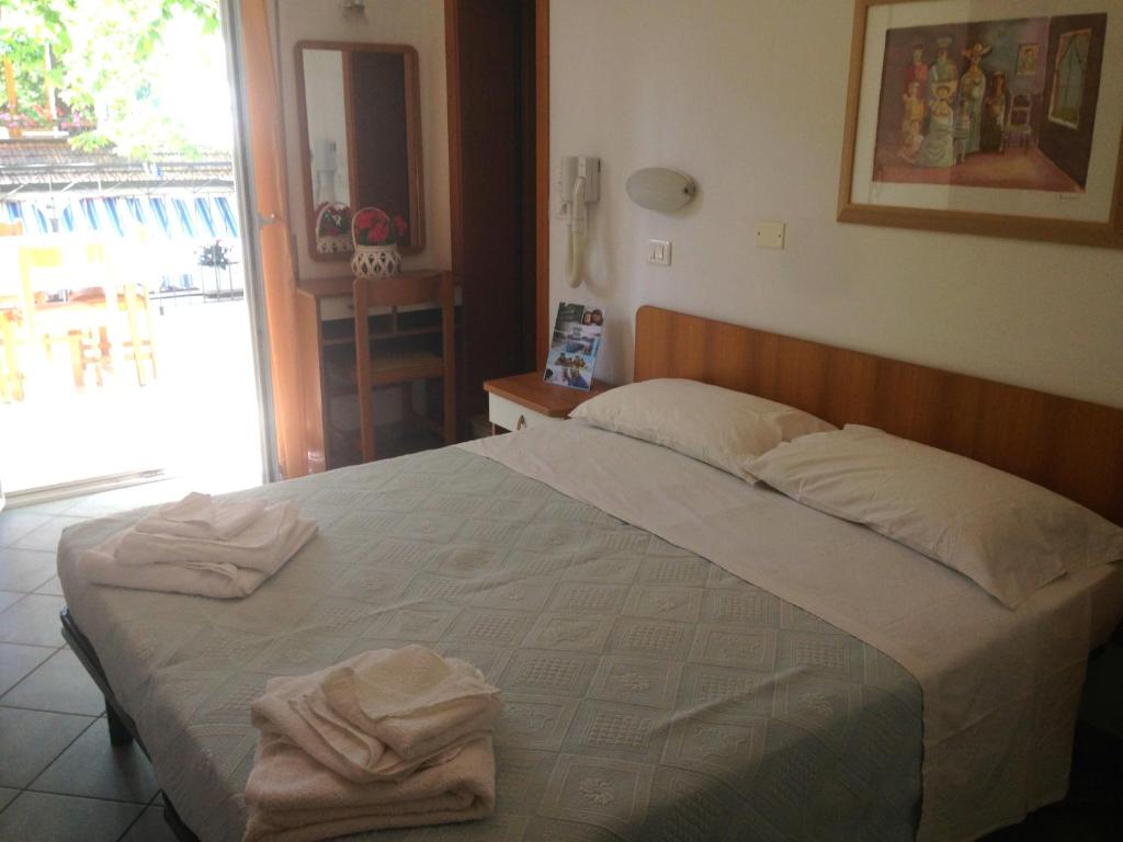 Postel nebo postele na pokoji v ubytování Hotel Jole