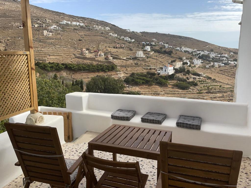 a balcony with a table and chairs and a view at Lagadi House 2 in Arnados