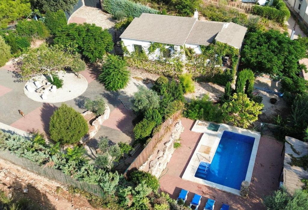 an overhead view of a house with a swimming pool at Casa Rural Pernales II in Ruidera