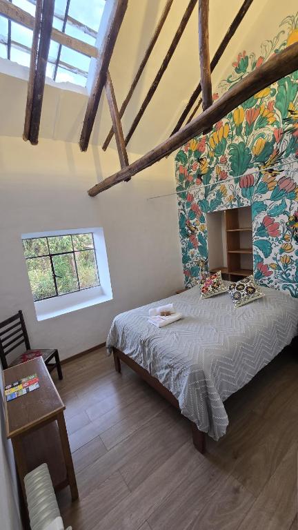 Rúm í herbergi á Flying Dog Hostel Cusco