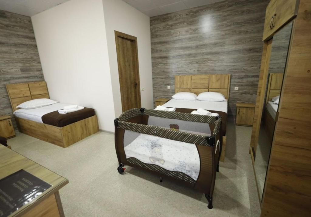 Postel nebo postele na pokoji v ubytování ANGINE Resort Hotel