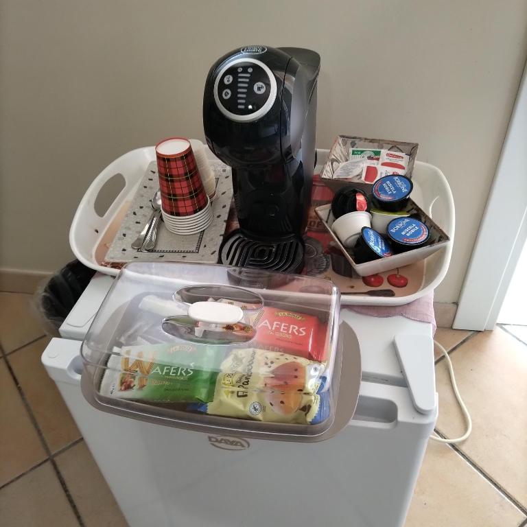 a black blender sitting on top of a refrigerator at B&B VILLA RITA in Silvi Marina