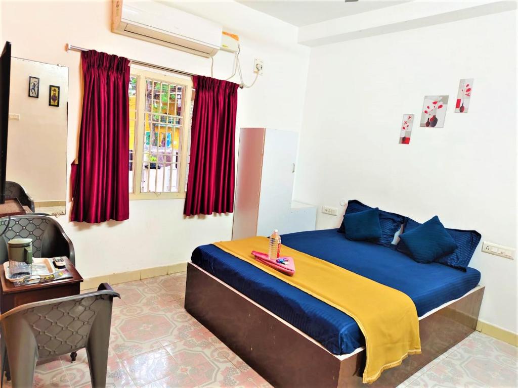 Ένα ή περισσότερα κρεβάτια σε δωμάτιο στο KK Beach View Residency