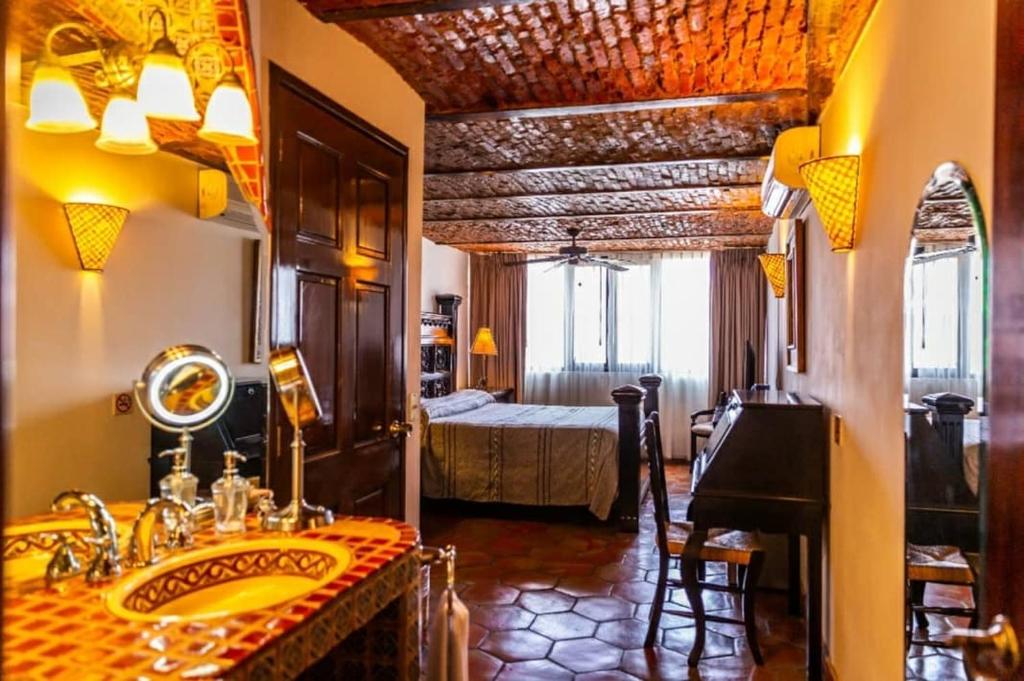 Postel nebo postele na pokoji v ubytování Quinta Don Jose Boutique Hotel