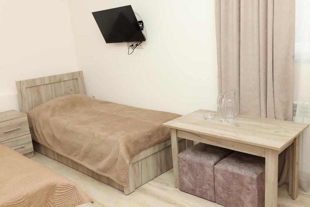 Postel nebo postele na pokoji v ubytování LyuArt Hotel