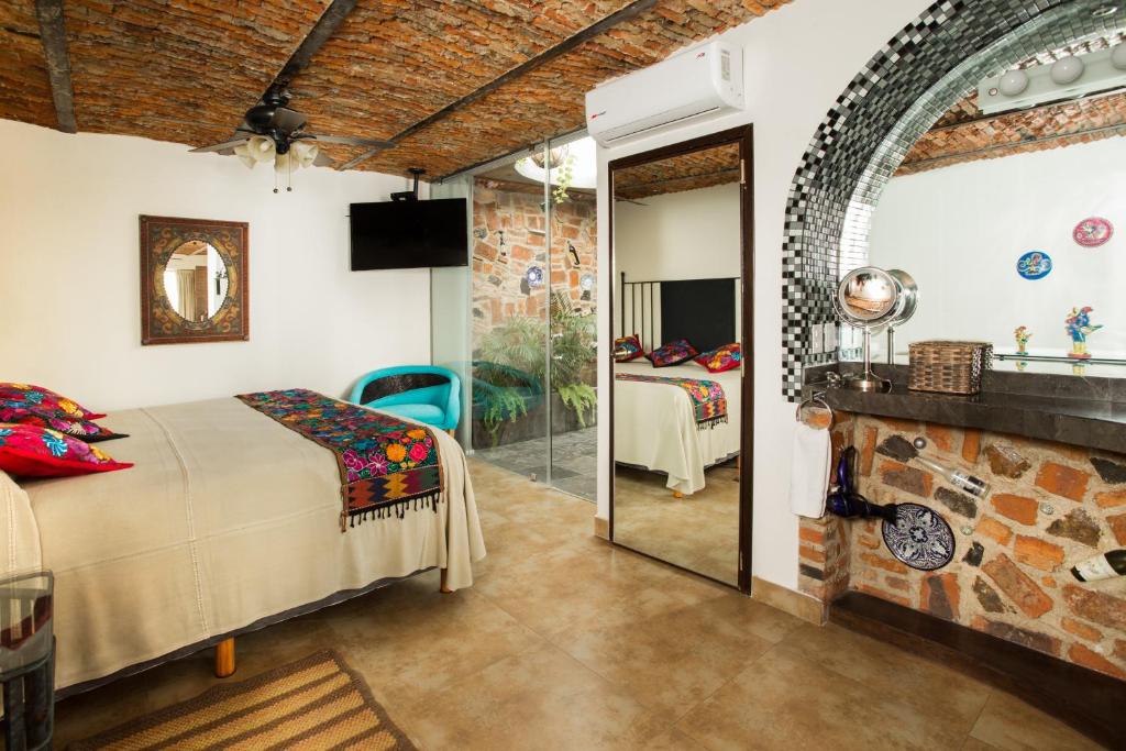 TV a/nebo společenská místnost v ubytování Quinta Don Jose Boutique Hotel