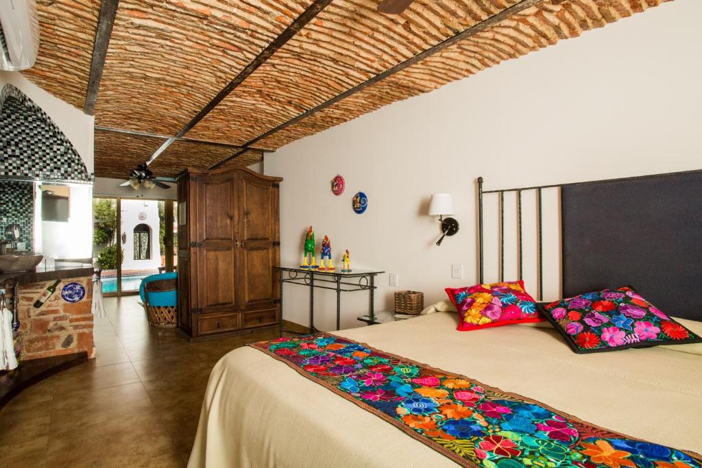 Postel nebo postele na pokoji v ubytování Quinta Don Jose Boutique Hotel