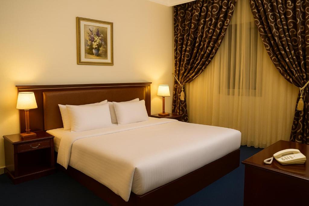 Postel nebo postele na pokoji v ubytování Dream Palace Hotel