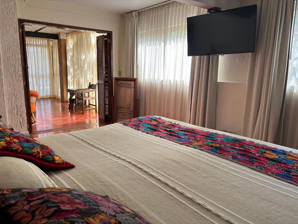Postel nebo postele na pokoji v ubytování Quinta Don Jose Boutique Hotel