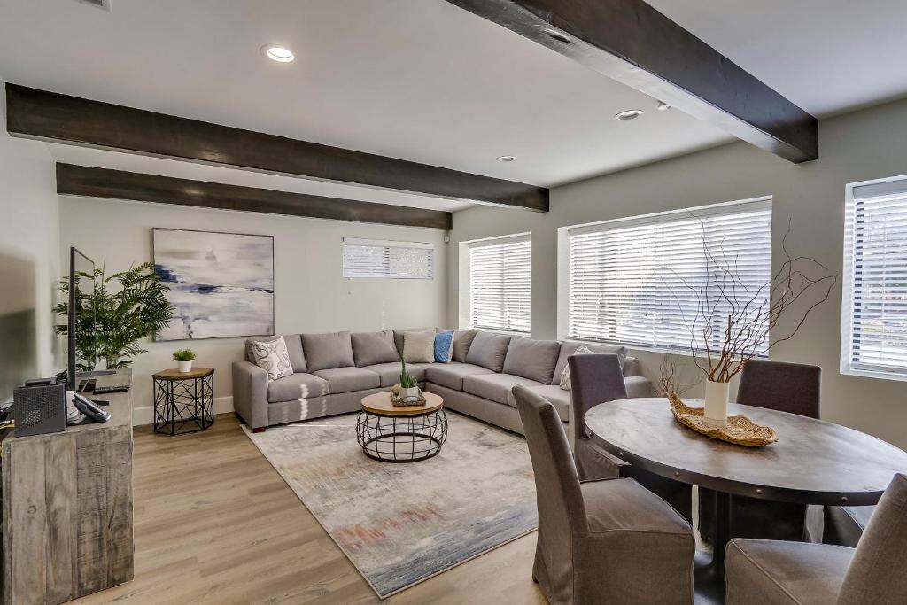 a living room with a couch and a table at 5 Bedroom plus loft room, 3 Bath home in Fullerton