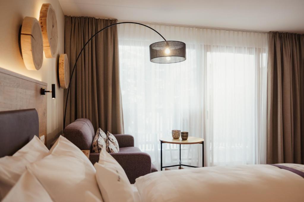 Postel nebo postele na pokoji v ubytování Hotel Diamant