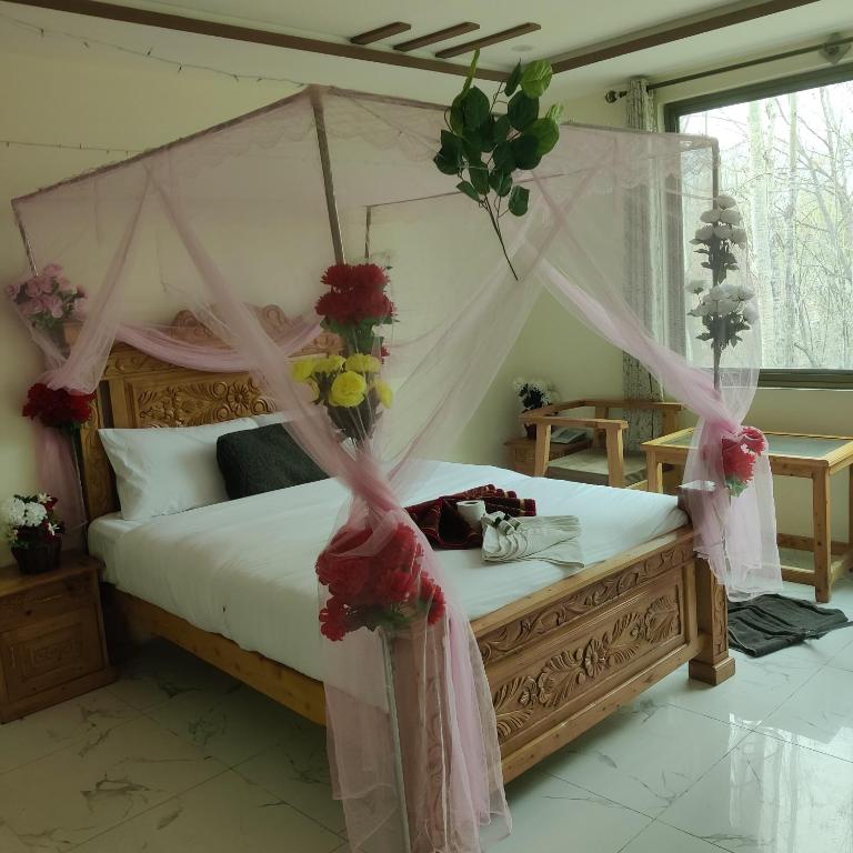 Postel nebo postele na pokoji v ubytování Arcadian Resort Skardu