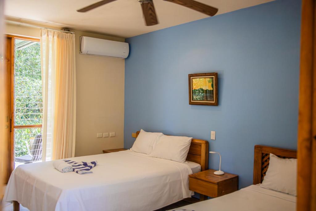 Postel nebo postele na pokoji v ubytování Hotel Sol Sámara