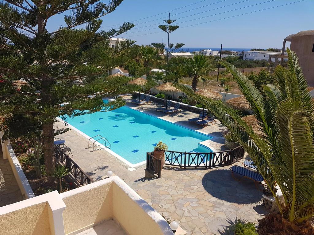 an overhead view of a swimming pool in a resort at Ira Apartments in Kamari