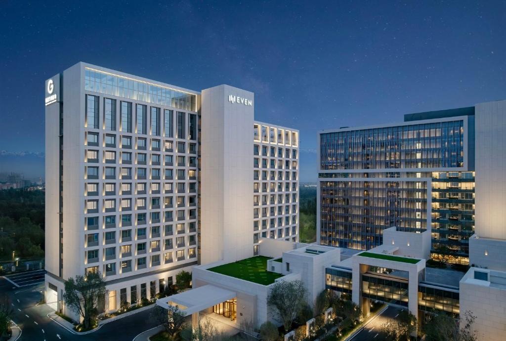 a view of a hotel with two tall buildings at EVEN Hotel Yining in Yining