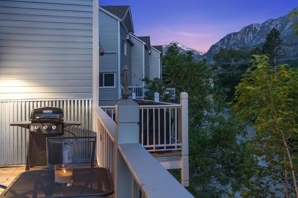 a balcony with a bbq and a grill at River Park 1254 in Ouray