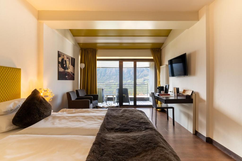 Postel nebo postele na pokoji v ubytování Hotel Gartner