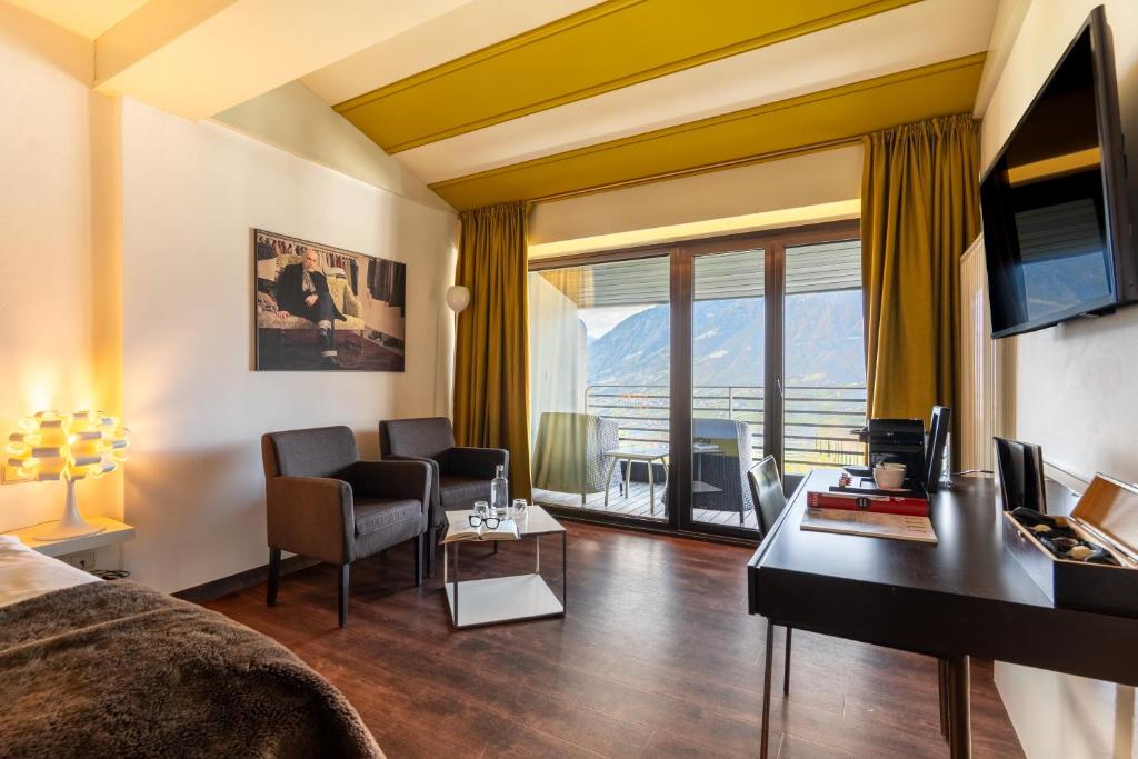 TV a/nebo společenská místnost v ubytování Hotel Gartner