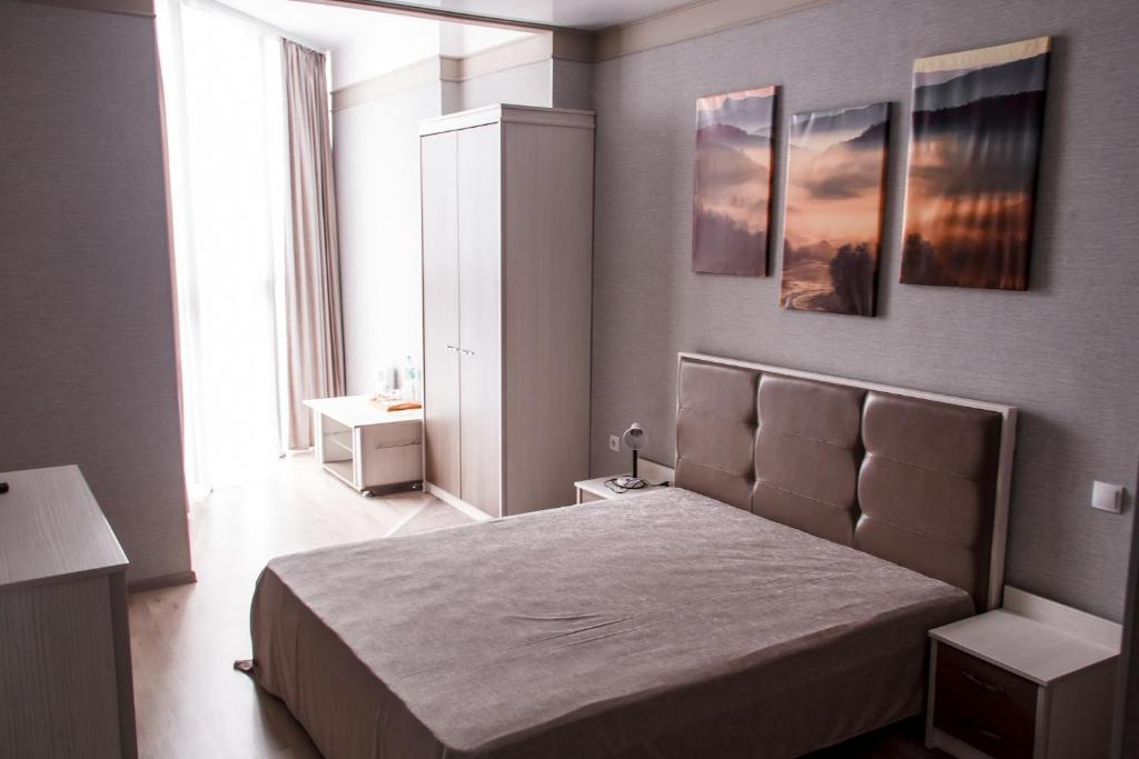 Postel nebo postele na pokoji v ubytování Elite Hotel