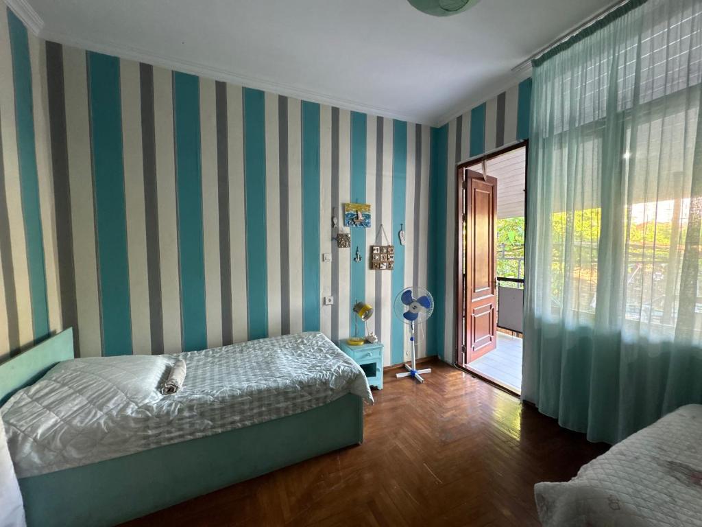 Postel nebo postele na pokoji v ubytování Green House in Batumi
