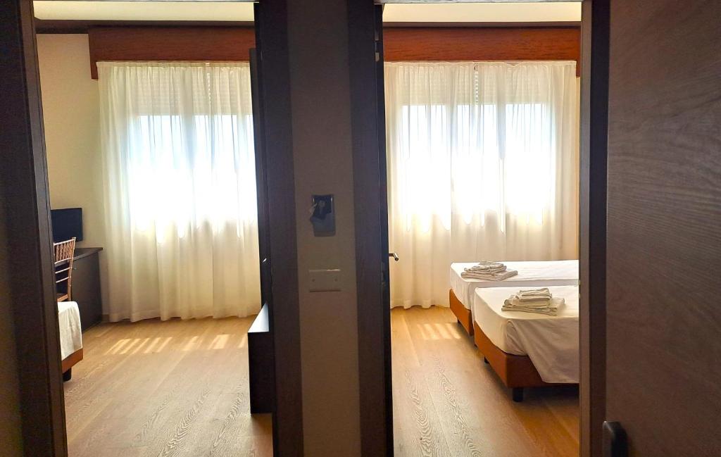 Postel nebo postele na pokoji v ubytování Hotel Internazionale
