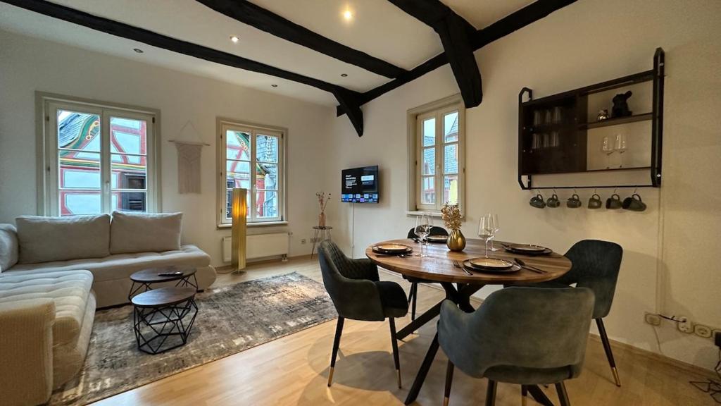 a living room with a table and a couch at Altstadt Perle in Limburg an der Lahn
