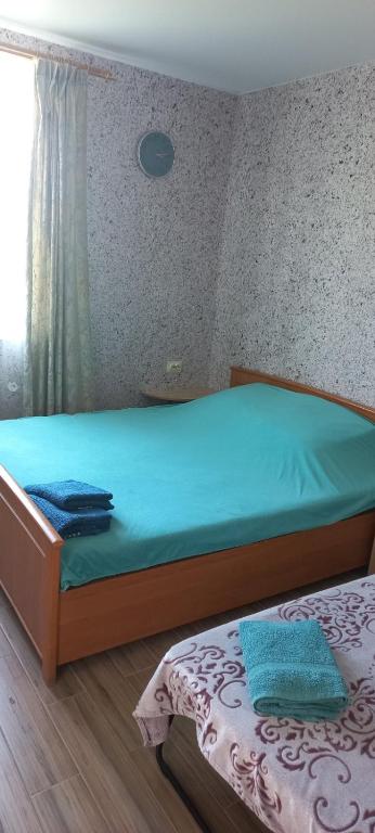 Letto o letti in una camera di Гостевой дом Уют