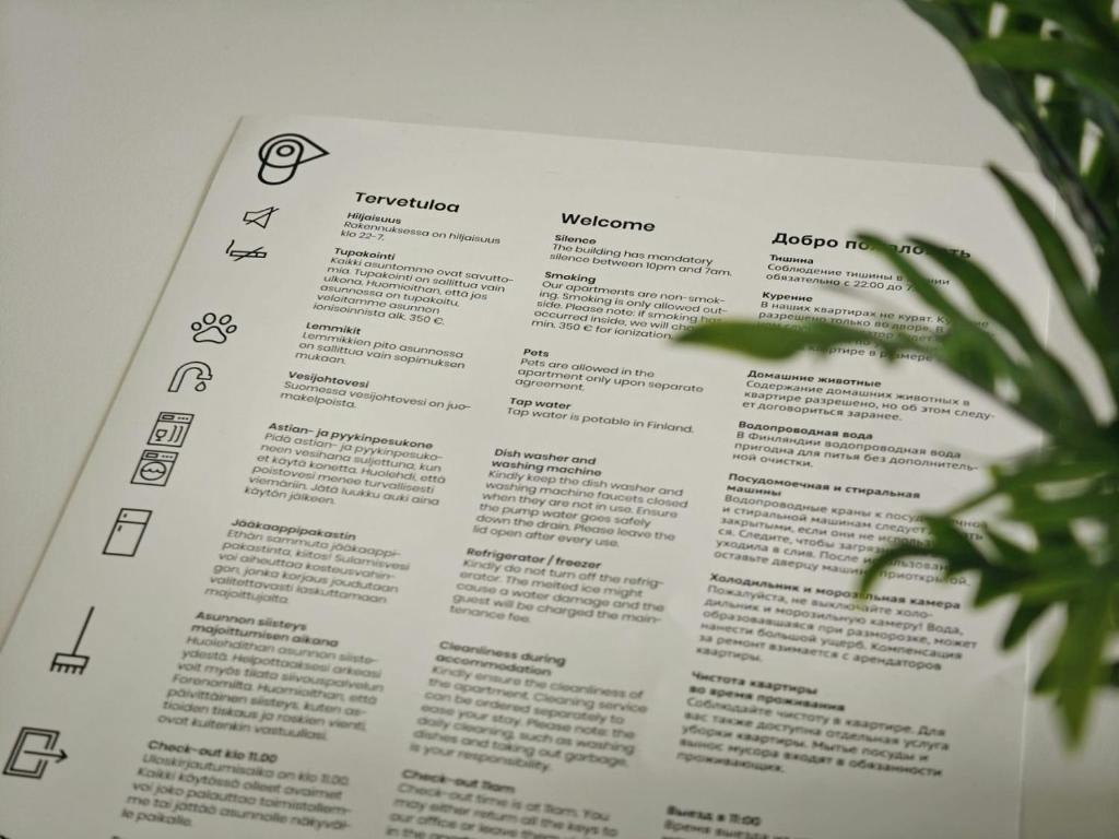 a page of a book with a plant at Spacious Apartment for 6 with Sauna in Oulu
