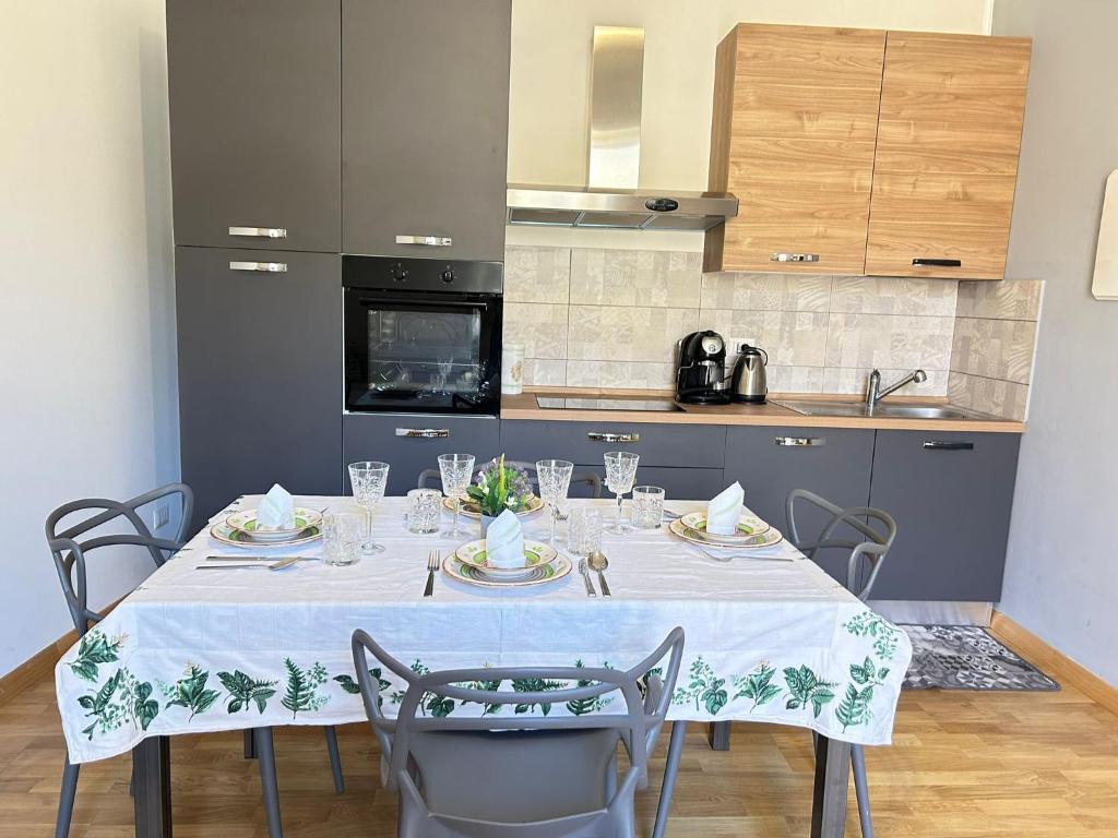 a dining room table with a white table cloth on it at CASA ARUCI in Avola