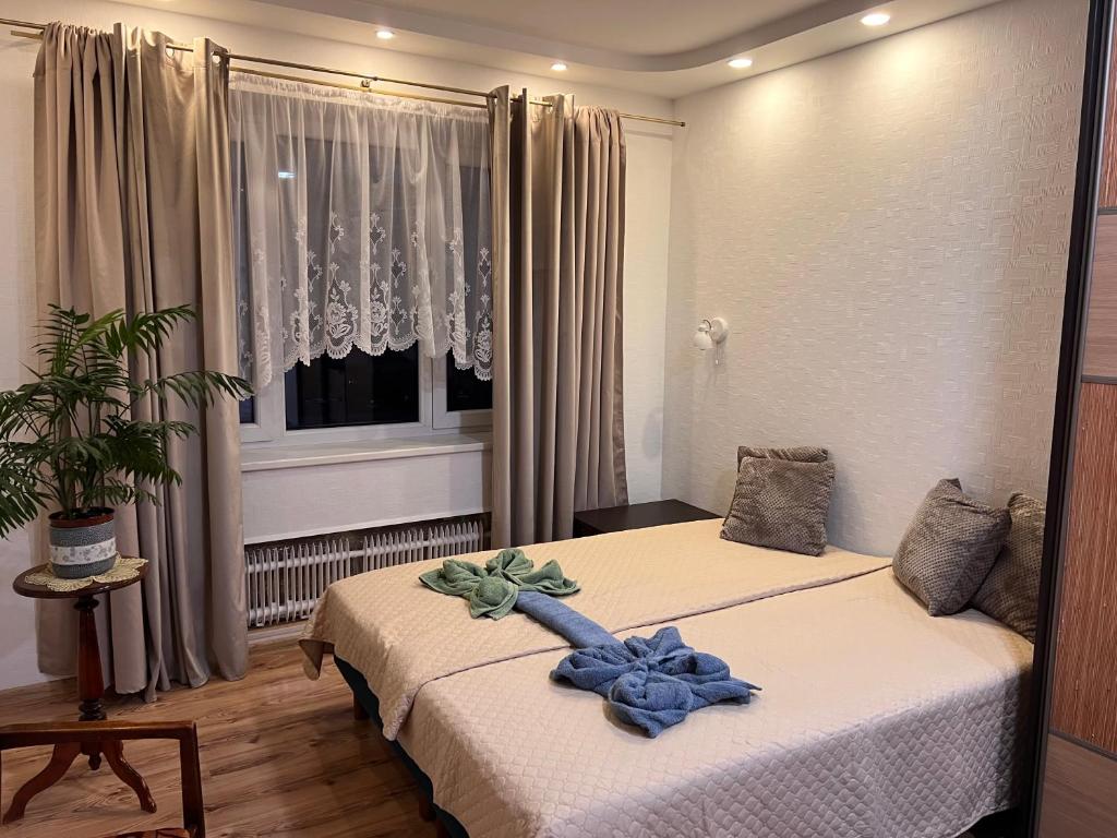 En eller flere senge i et værelse på Prisiminkim praeitį