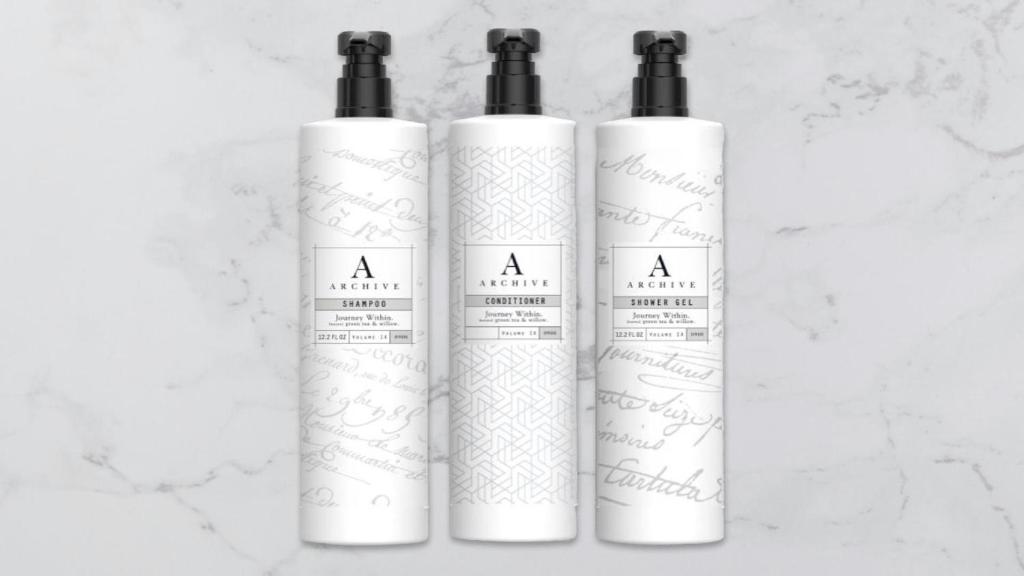 three white bottles of sunscreen sitting on a counter at Sonesta Atlanta Airport North in Atlanta