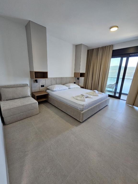 Postel nebo postele na pokoji v ubytování Apartmani Leženić M