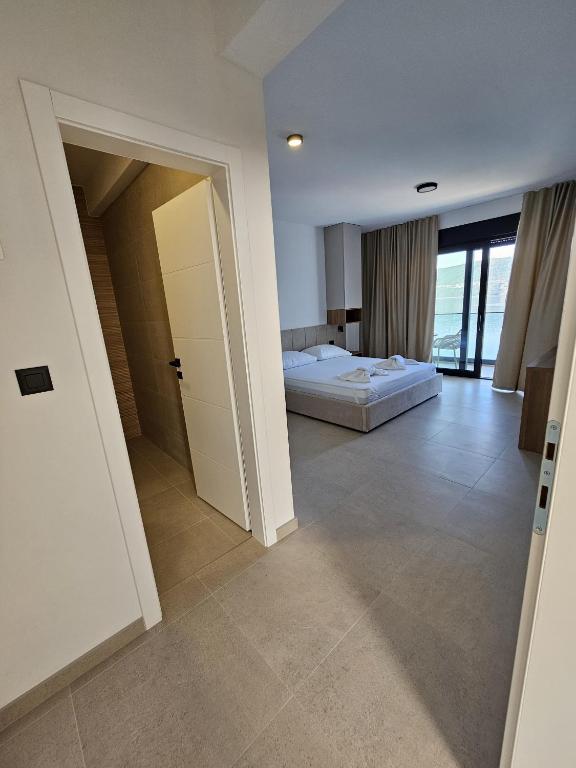 Postel nebo postele na pokoji v ubytování Apartmani Leženić M