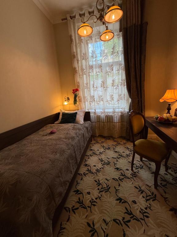 Postel nebo postele na pokoji v ubytování Hotel Rudolf II Karlovy Vary