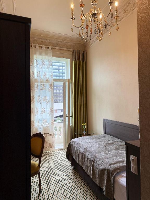 Postel nebo postele na pokoji v ubytování Hotel Rudolf II Karlovy Vary