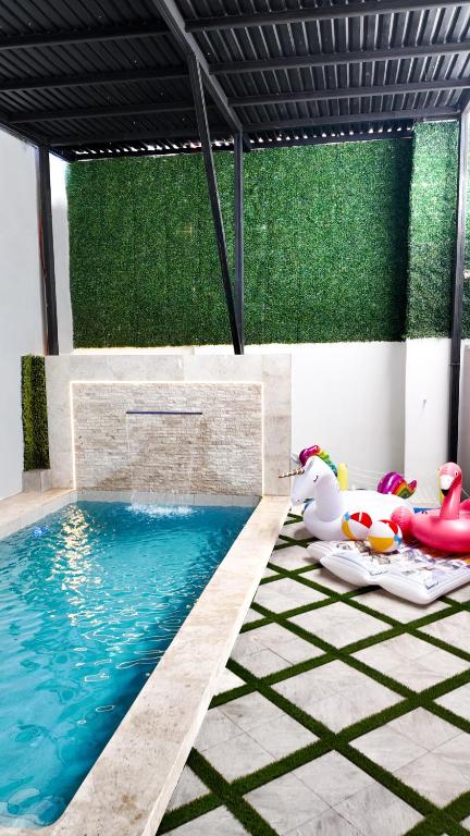 a pool with some toys in a room at White House Cabo in Cabo San Lucas