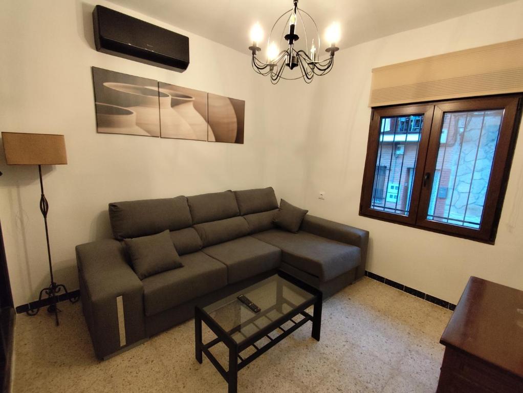 a living room with a couch and a table at El Corazón de Gredos II in Arenas de San Pedro